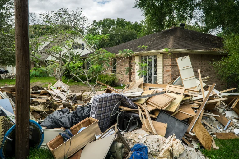 A damaged house being evaluated by a public adjuster for claim processing
