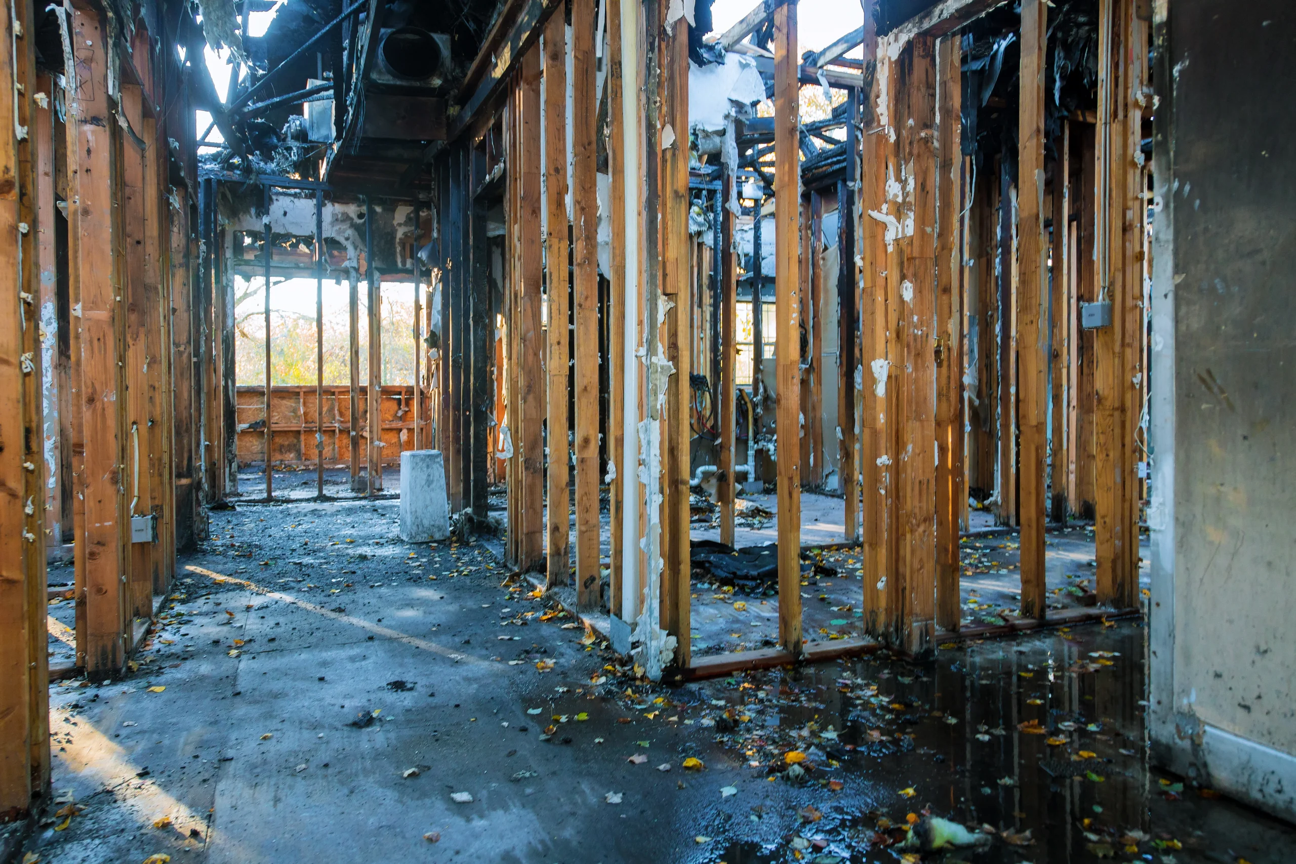 Interior view of a fire-damaged house awaiting a public claims adjuster review