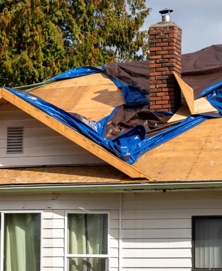 rooftop with visible damage, marked for insurance assessment by public adjuster