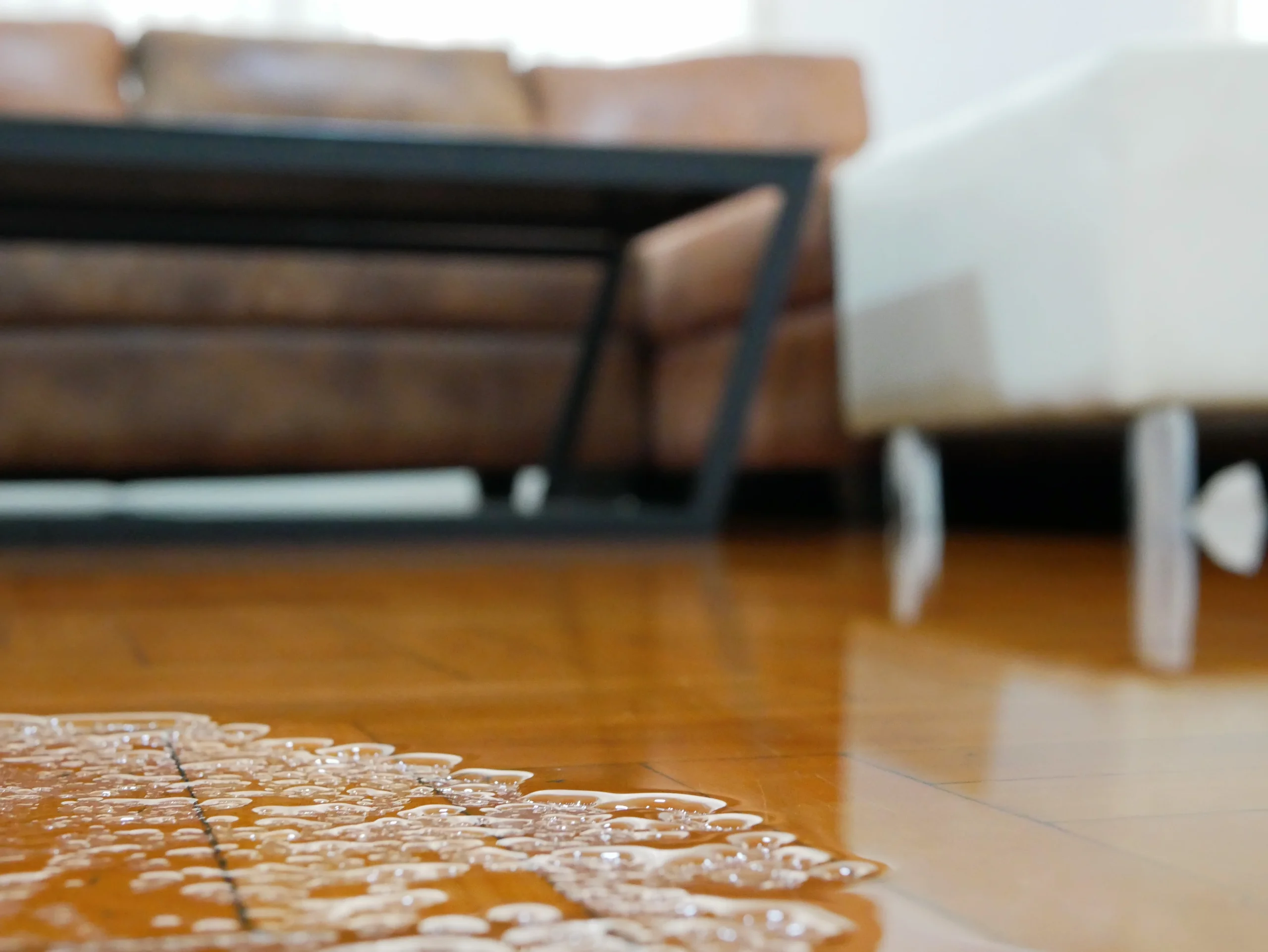 A flood-damaged living room marked for public adjuster near me visits